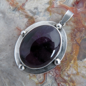 Oval 4 Point Amethyst Pendant in Hallmarked 925 Sterling Silver with Textured Border