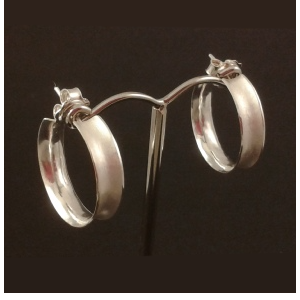 Silver anticlastic hoop earrings