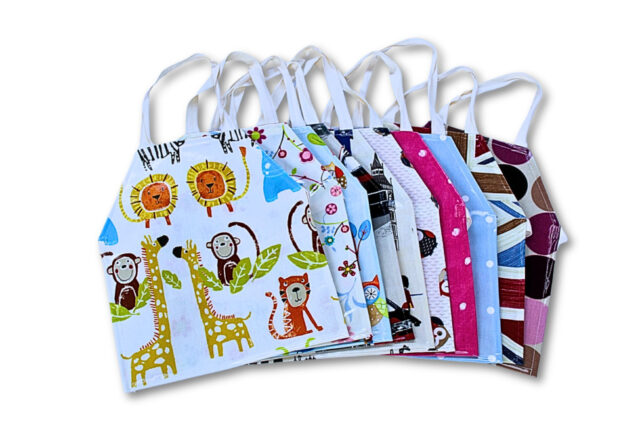 Bundle of 10 Children's Small Wipe Clean Oilcloth Aprons